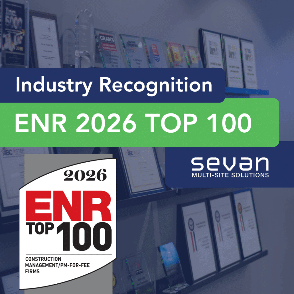 A wall display of awards and plaques highlights Sevan Multi-Site Solutions' recognition as an ENR 2026 Top 100 Construction Management firm.
