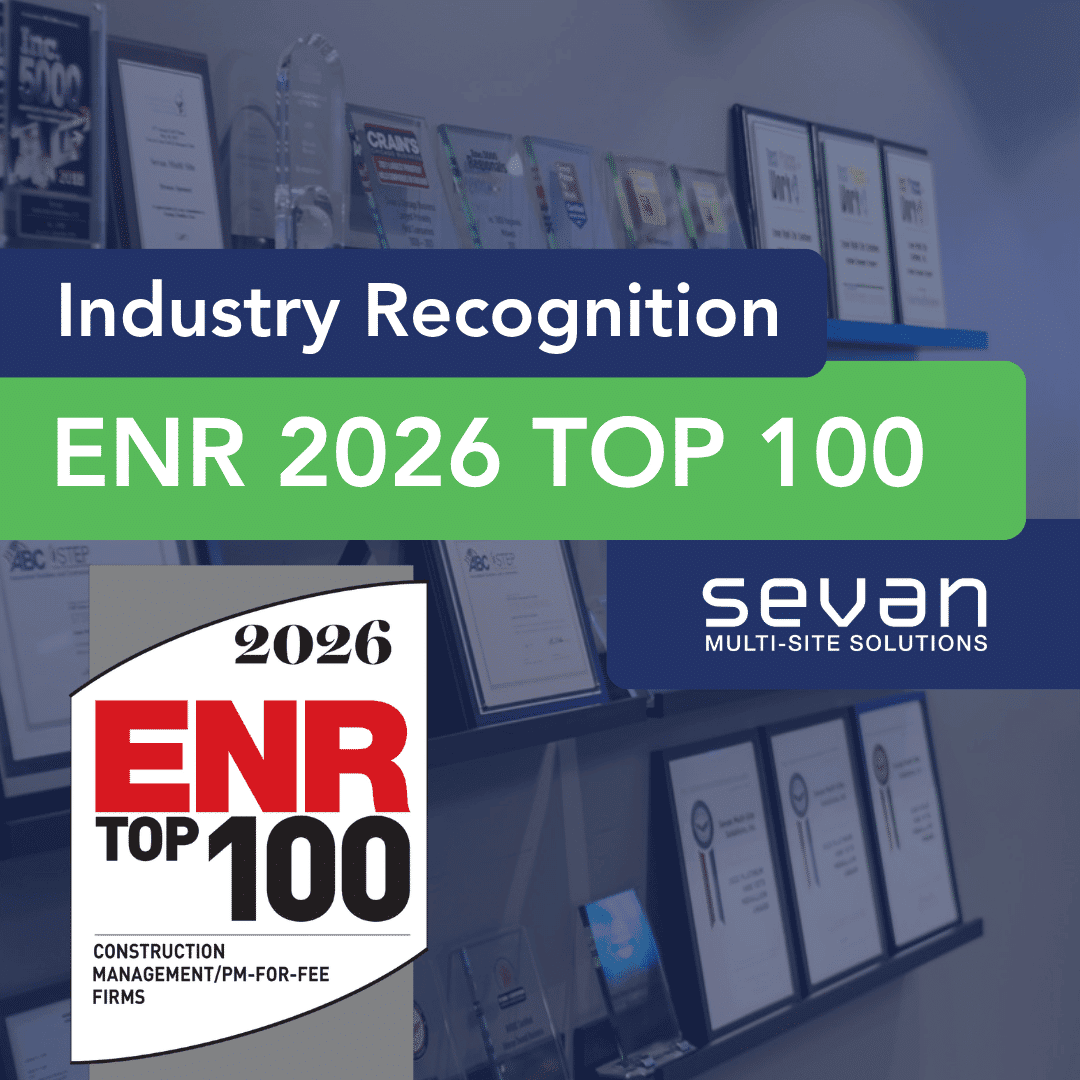 A wall display of awards and plaques highlights Sevan Multi-Site Solutions' recognition as an ENR 2026 Top 100 Construction Management firm.