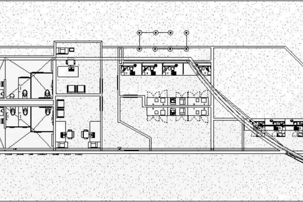 Black and white architectural floor plan showing multiple rooms, desks, and partitioned office spaces with various lines indicating walls and pathways.